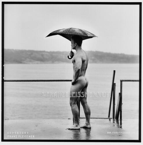 Portrait of a handsome with out clothes, posing and standing at the seaside in sweden..